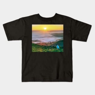 A dog watching the sunrise on Mam Tor, Derbyshire, UK Kids T-Shirt